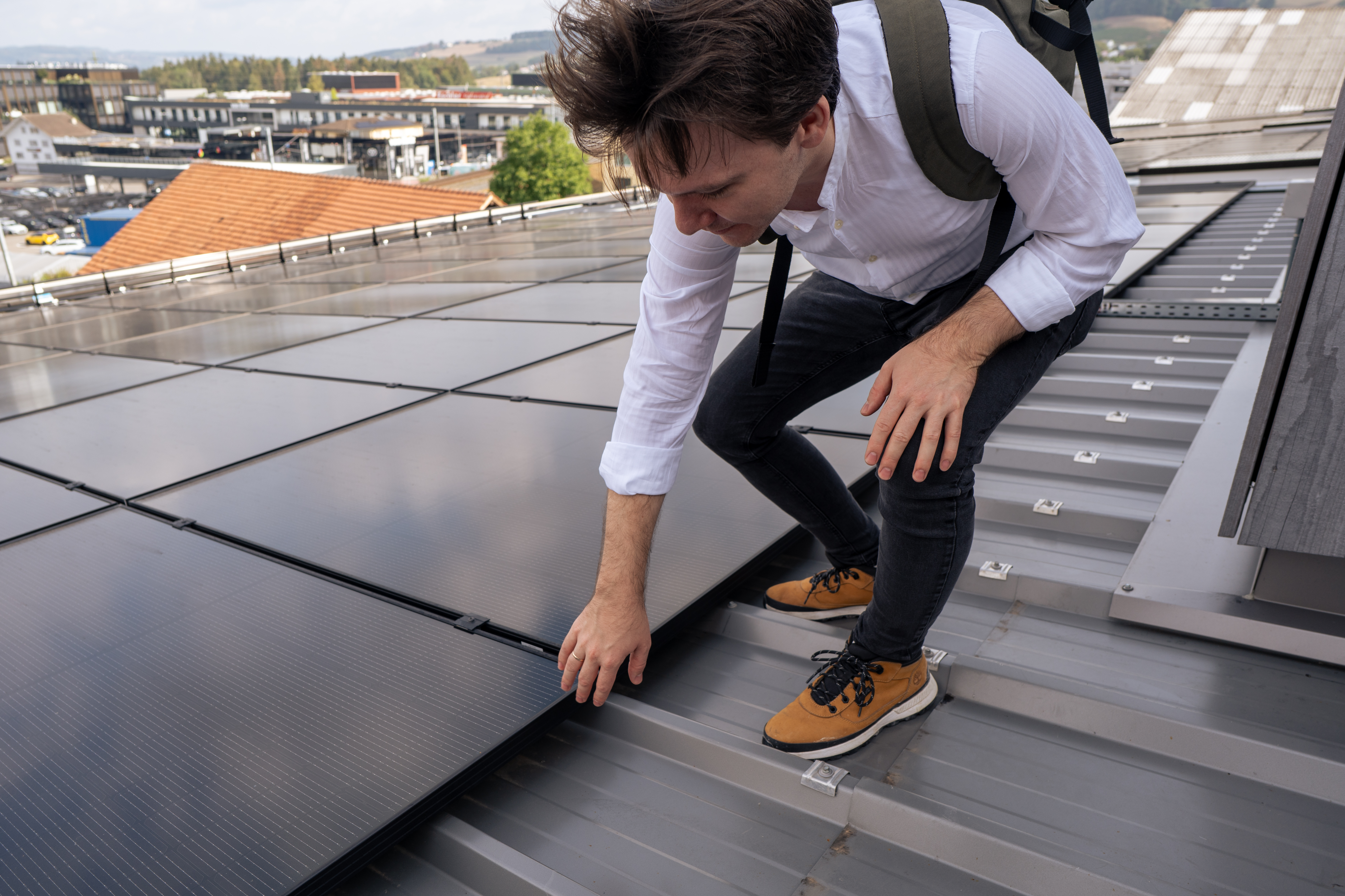 Christoph Fischer at a rooftop solar array